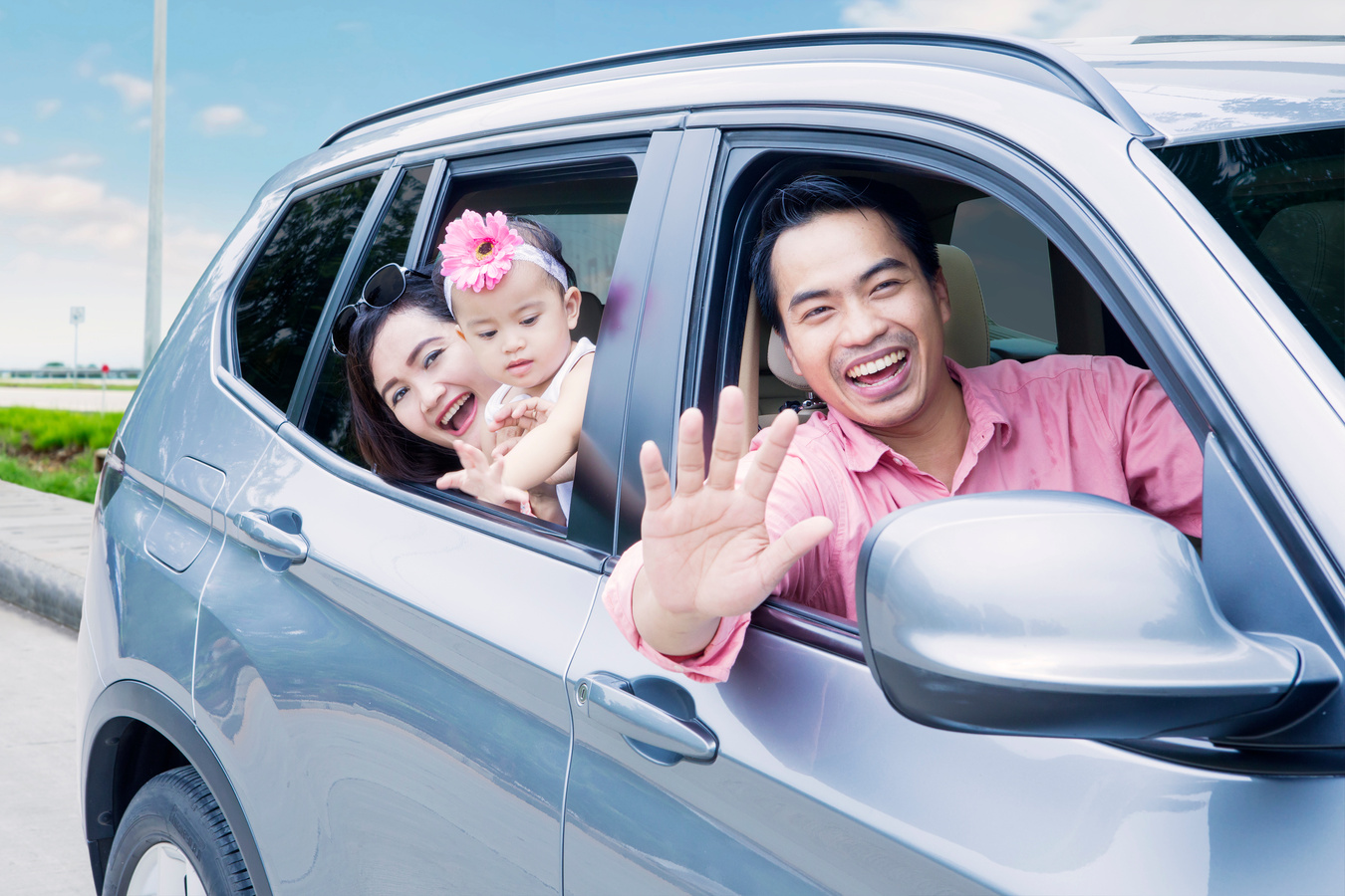 Happy Family Looking Out Car Window